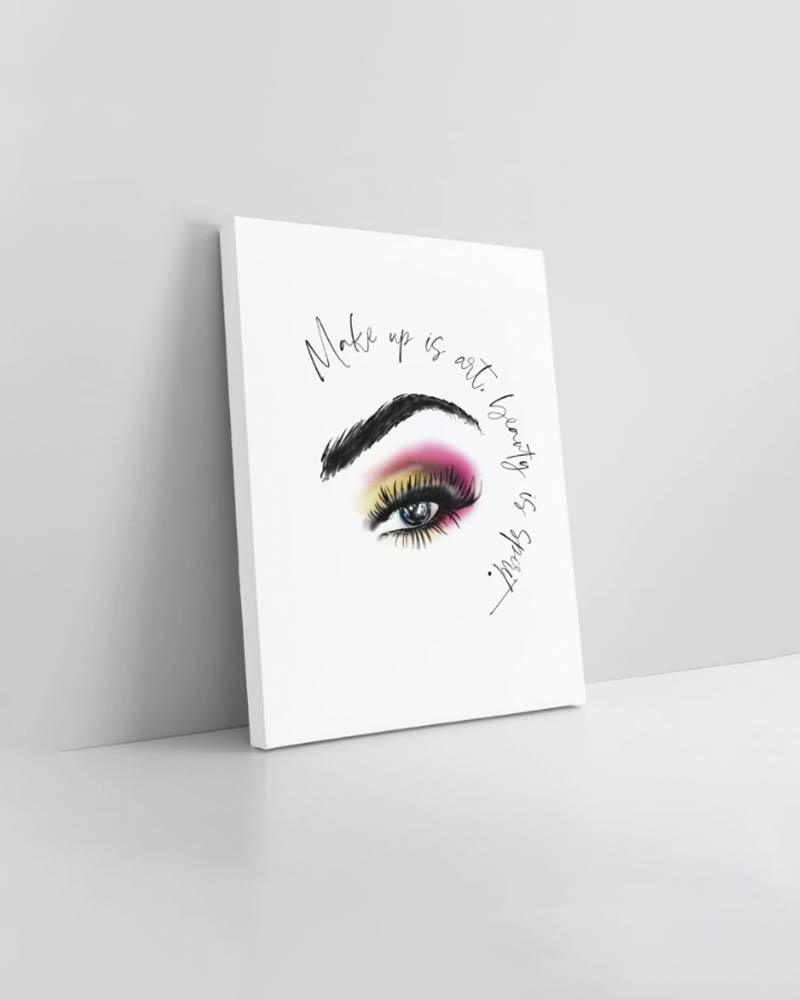 Art print with the words, make up is art,beauty is spirit written in cursive with a close up of a woman's eye with pink and green eyeshadow